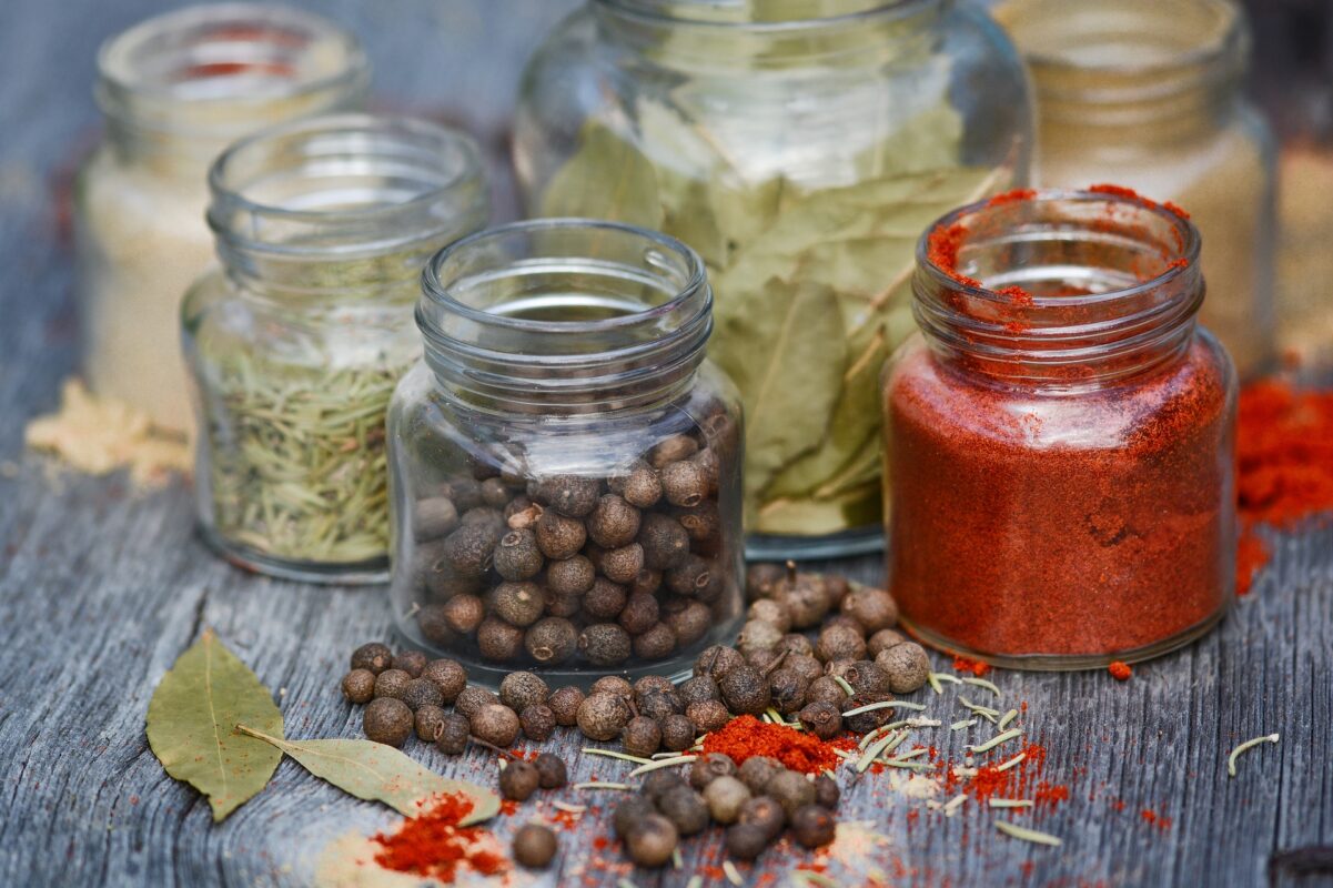 Jars of colorful dried herbs