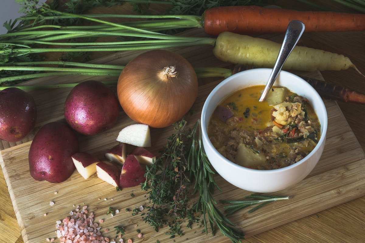 A homemade root vegetable soup with fresh ingredients, perfect for a cozy dinner.